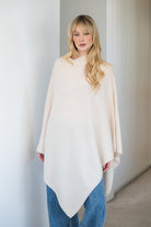 V-Neck Travel Poncho in White - 100% cashmere poncho with ribbed edges