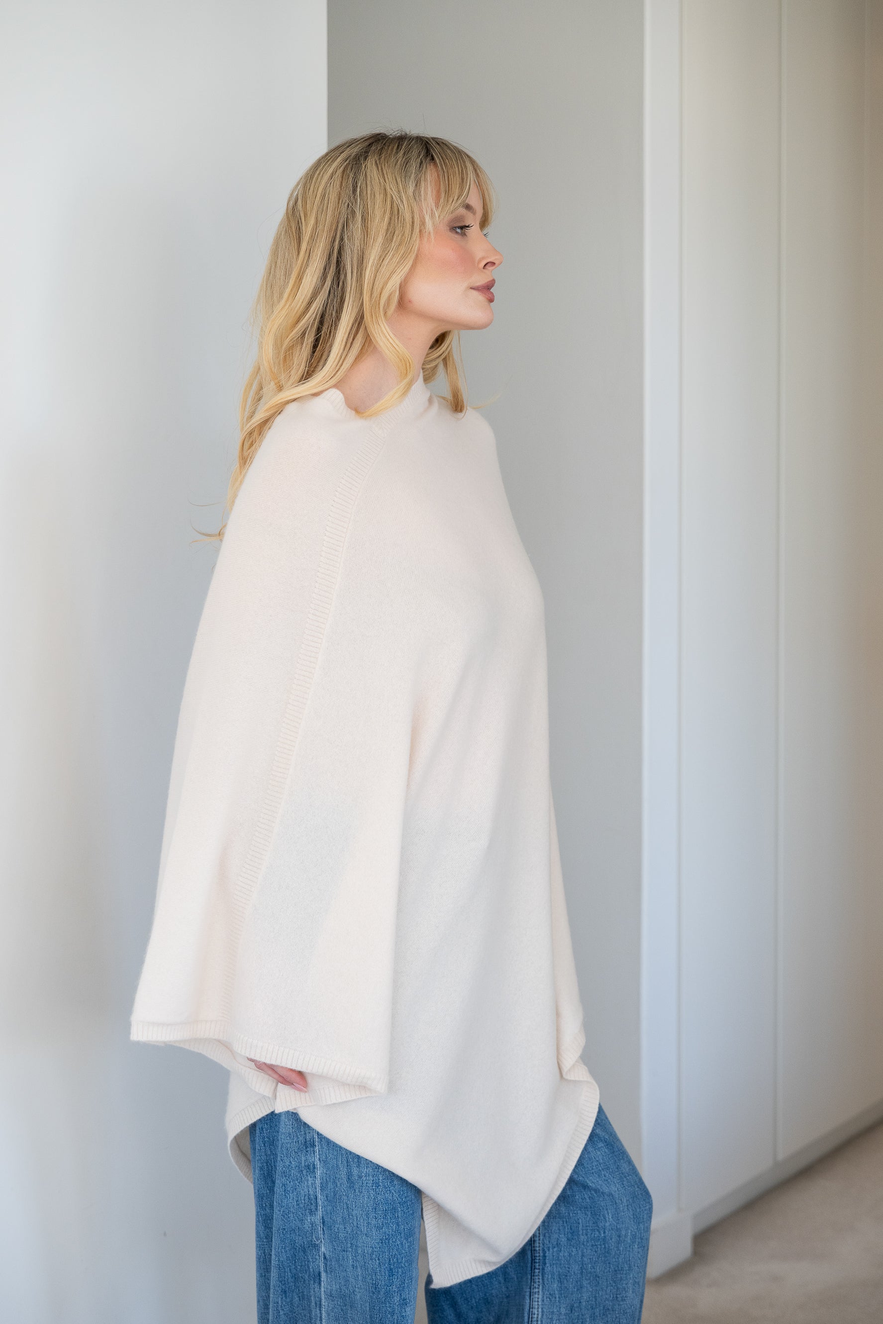 V-Neck Travel Poncho in White - 100% cashmere poncho with ribbed edges